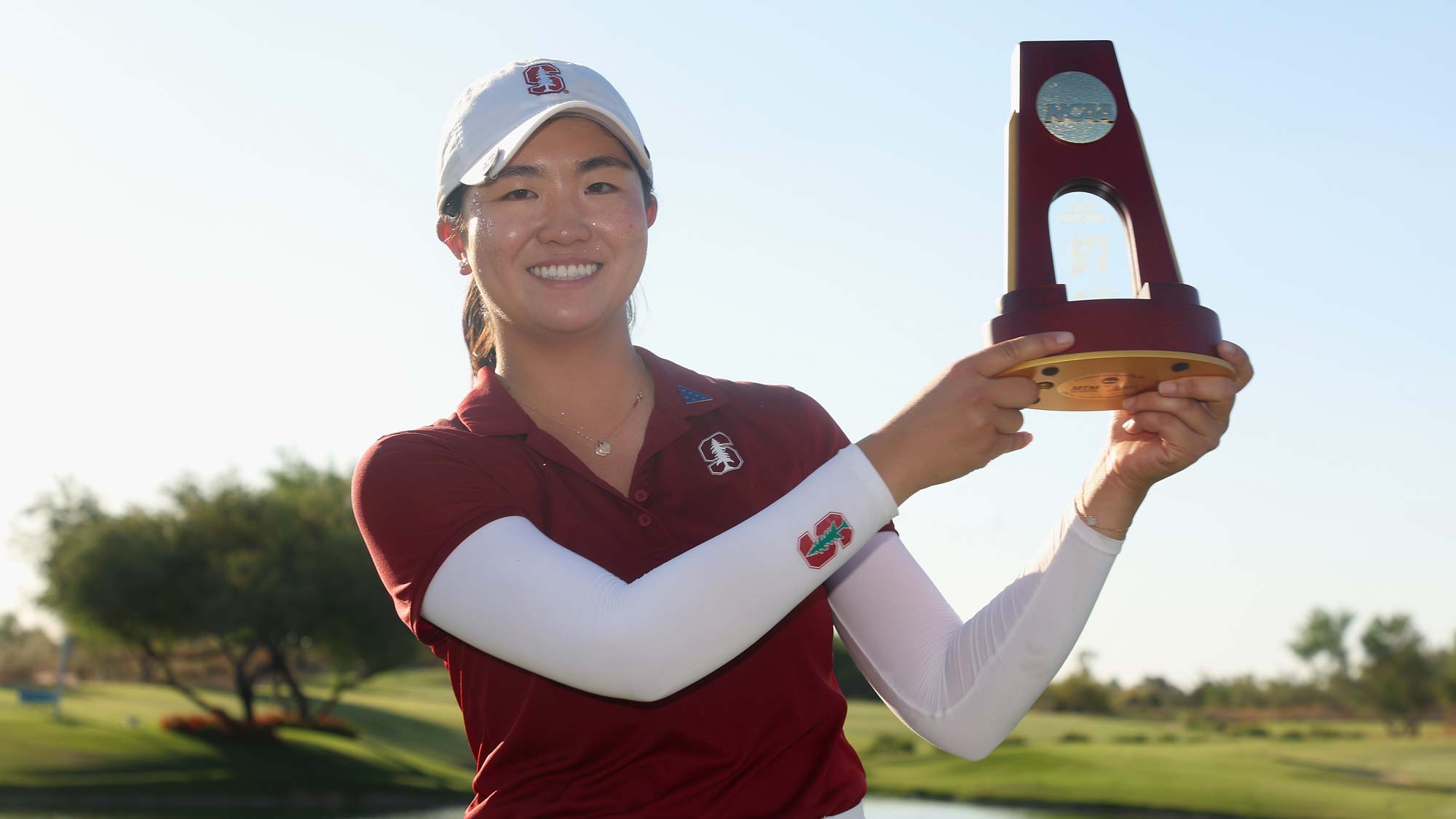 Rose Zhang of the Stanford Cardinal poses with the trophy after winning the NCAA women’s Golf Championships at Grayhawk Golf Club